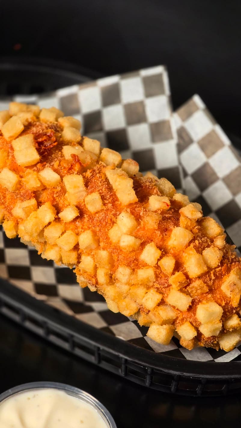 Hot Potato cubierta con papa crujiente y hot honey